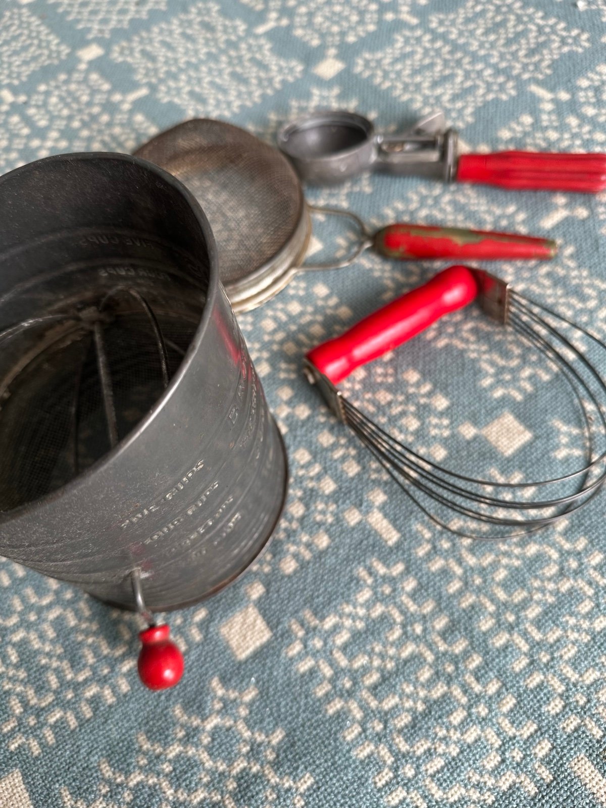 4 Vtg.red handled kitchen tools- dough blender,sifter,strainer and scoop