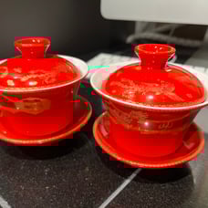 Tea cups with lids and saucer