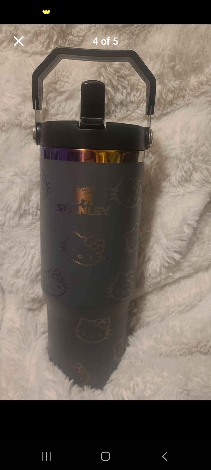 Stanley 30oz flip straw hello kitty tumbler grey and oil slick.