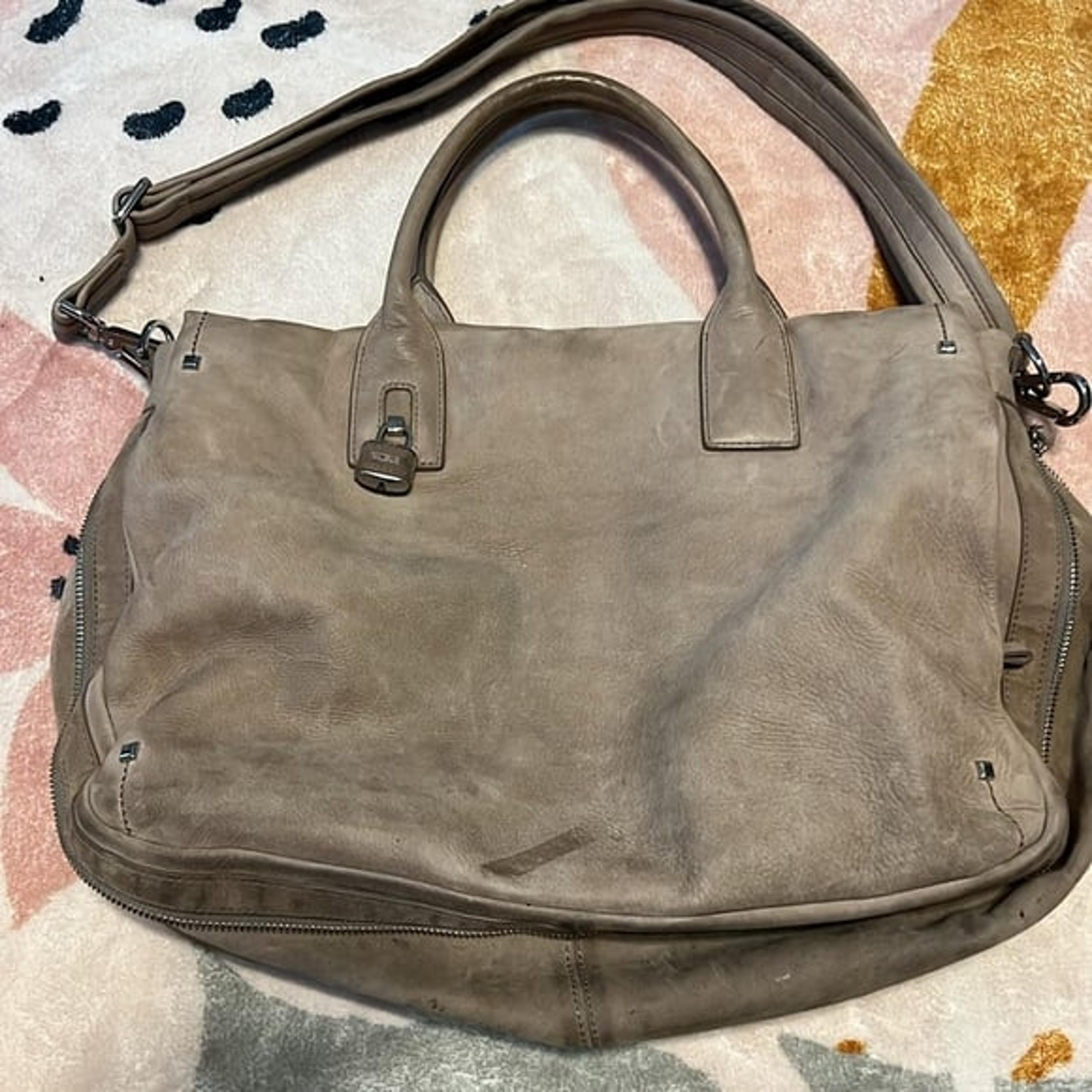 Authentic Tumi suede women’s shoulder bag