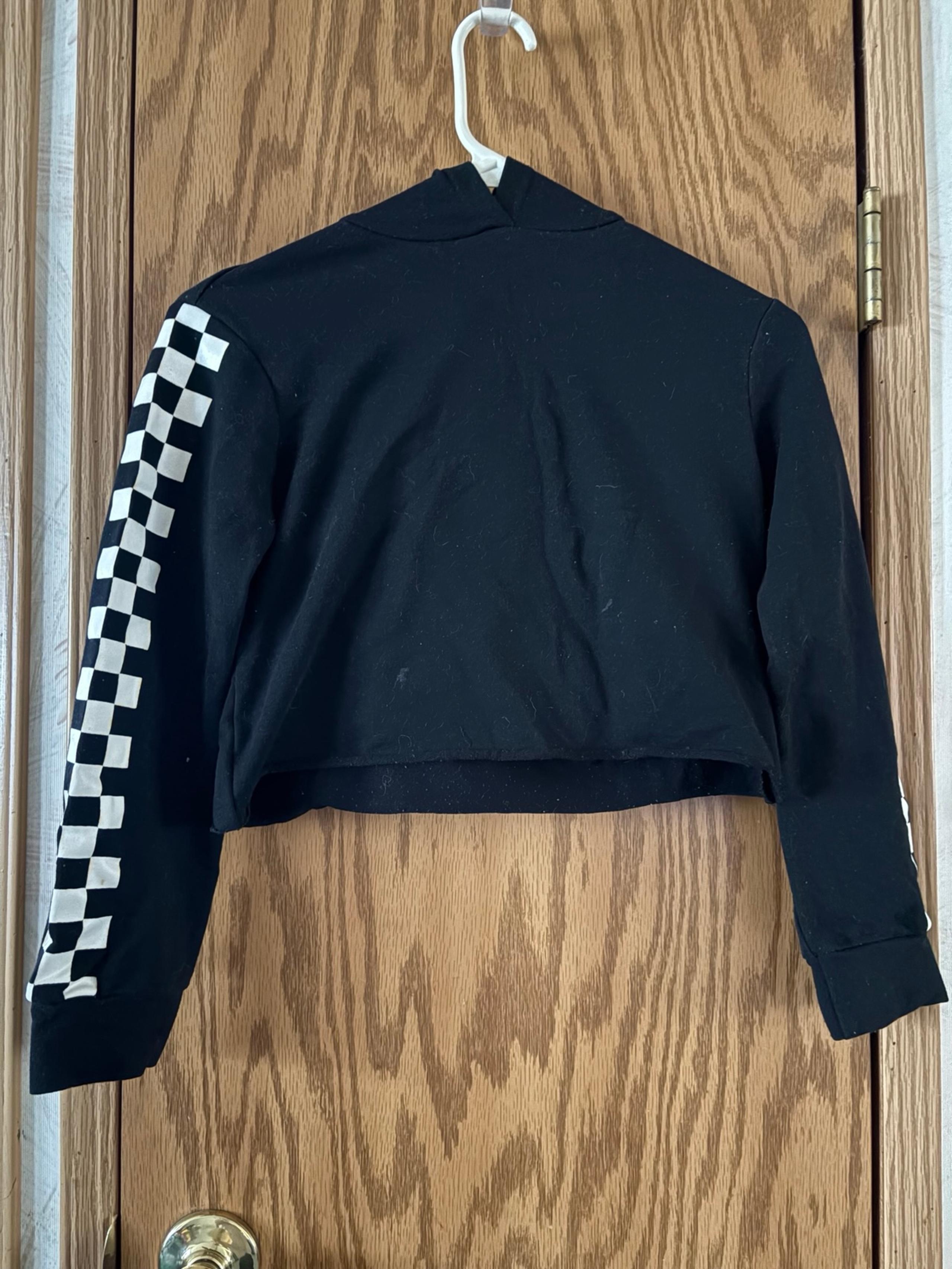 Black crop top with checkered sleeves and hood