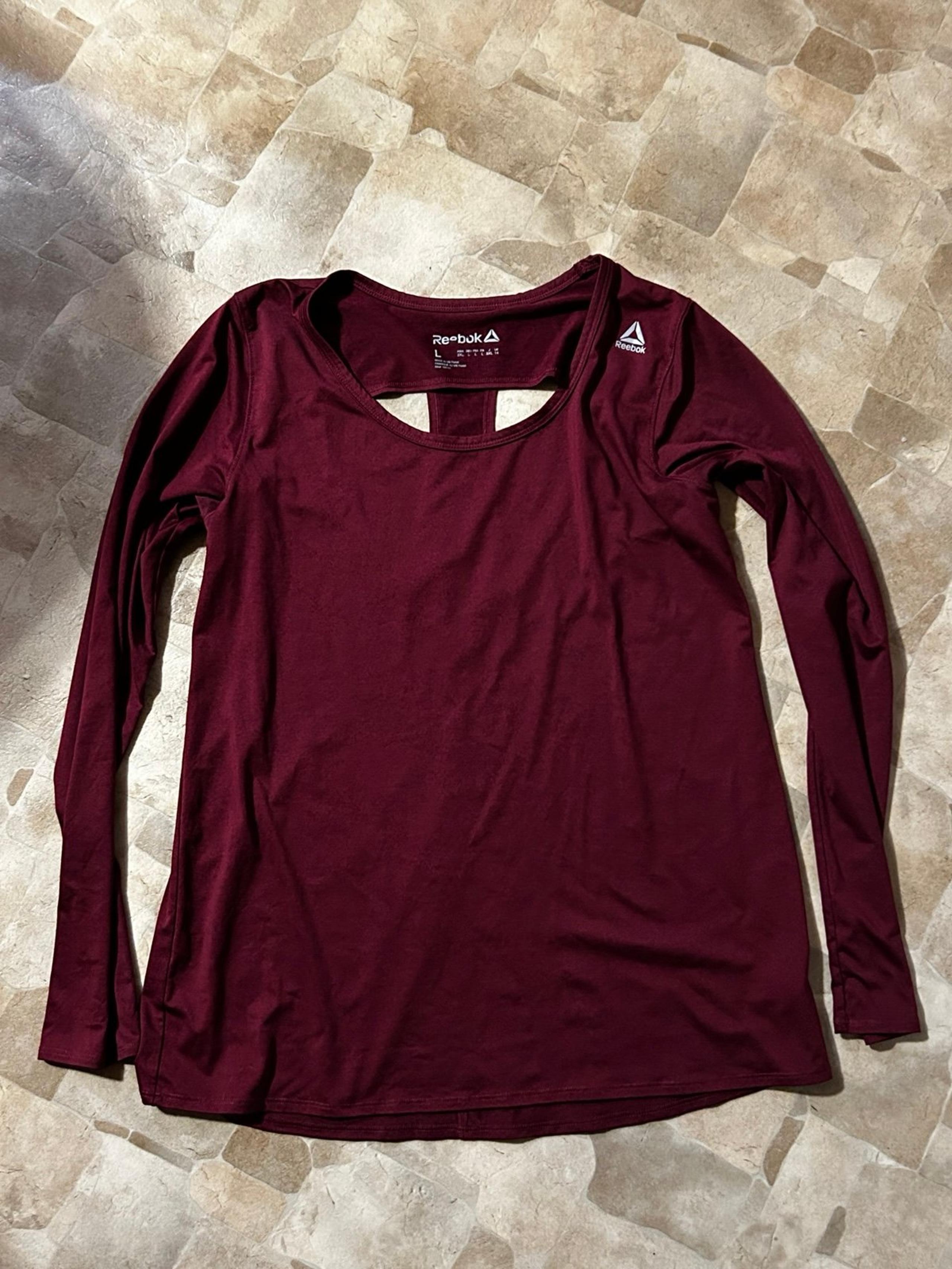 Women’s Reebok size large long sleeve open back athletic shirt