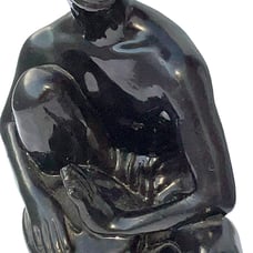 Statue of African boy playing a drum