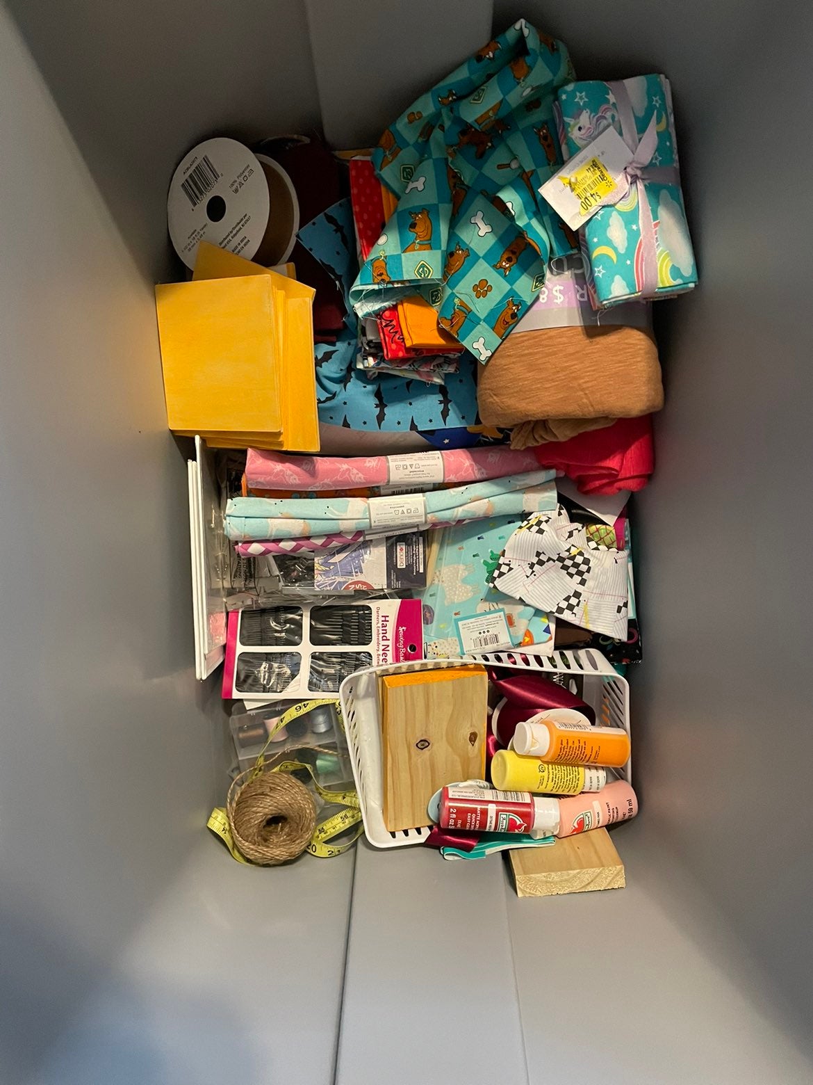 A lot of fabric and other crafting supplies
