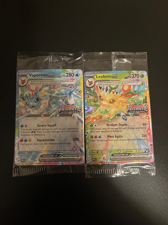 Pokemon Prismatic Evolutions stamped Promo Vaporeon and Leafeon