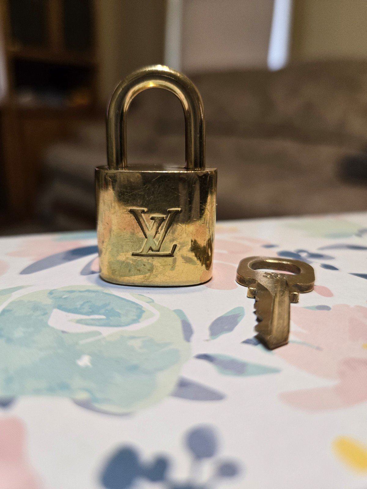 Authentic Louis Vuitton LV gold lock and key number 301 in good condition