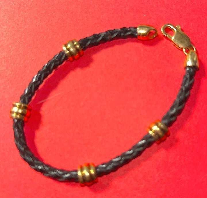 STUNNING 14k gold and braided Black leather bracelet. FREE SHIPPING