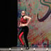 Red and black custom dance costume with rhinestones and fringe.