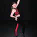 Red and black custom dance costume with rhinestones and fringe.