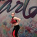 Red and black custom dance costume with rhinestones and fringe.