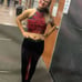 Red and black custom dance costume with rhinestones and fringe.