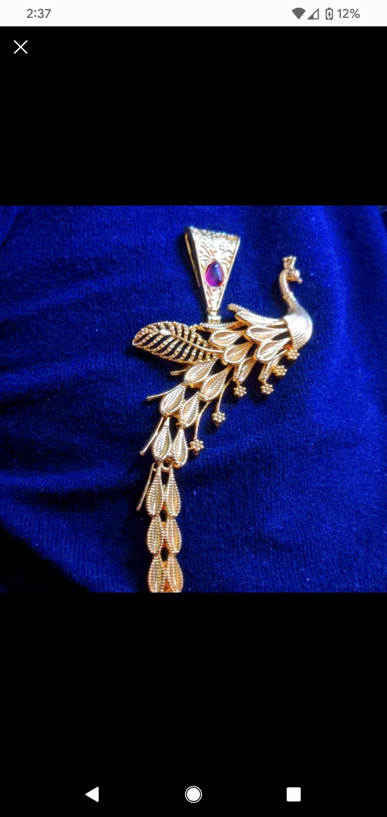 Gold peacock pendant