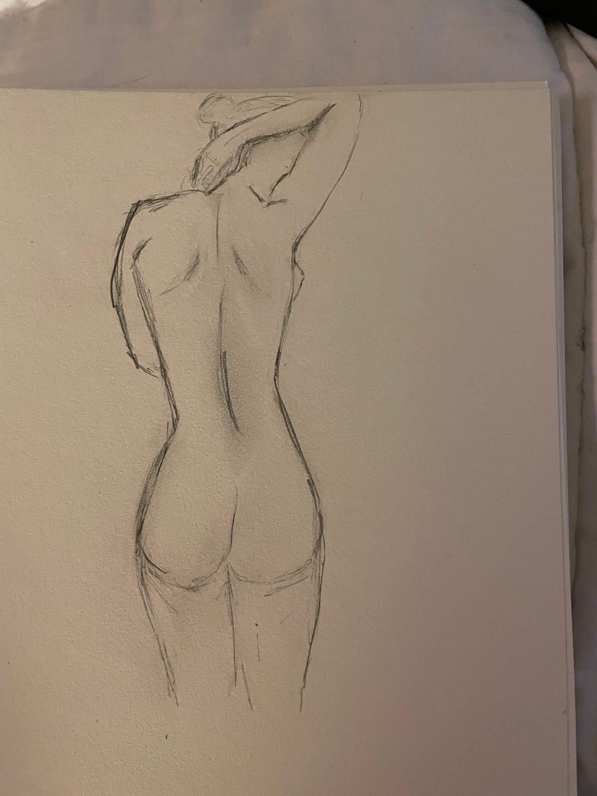Charcoal sketch of nude woman
