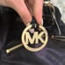 Spacious black and gold Michael Kors Shoulder Purse