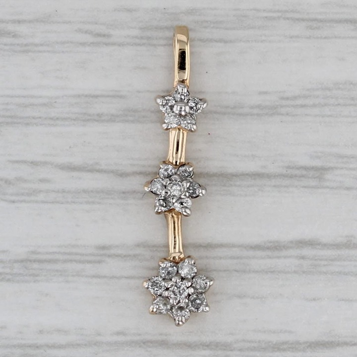 0.15ctw Diamond Flowers Journey Pendant 10k Yellow Gold Drop