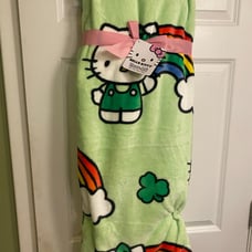 FIRM Hello Kitty St. Patrick’s Day plush throw (rainbow/shamrock)