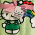 FIRM Hello Kitty St. Patrick’s Day plush throw (rainbow/shamrock)