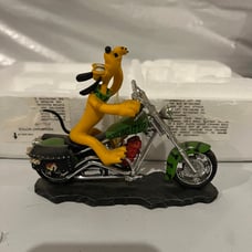 Howing it Up Pluto on Motorcycle