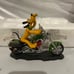 Howing it Up Pluto on Motorcycle