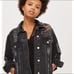 Distressed denim jacket