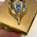 Vintage Golden Blue Rhinestone Stylized Fleur-de-lis Mirror Powder Compact