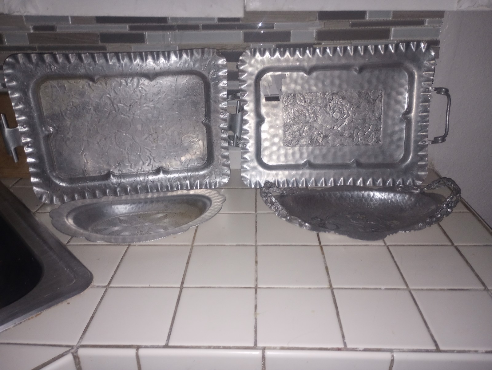 Four silver trays