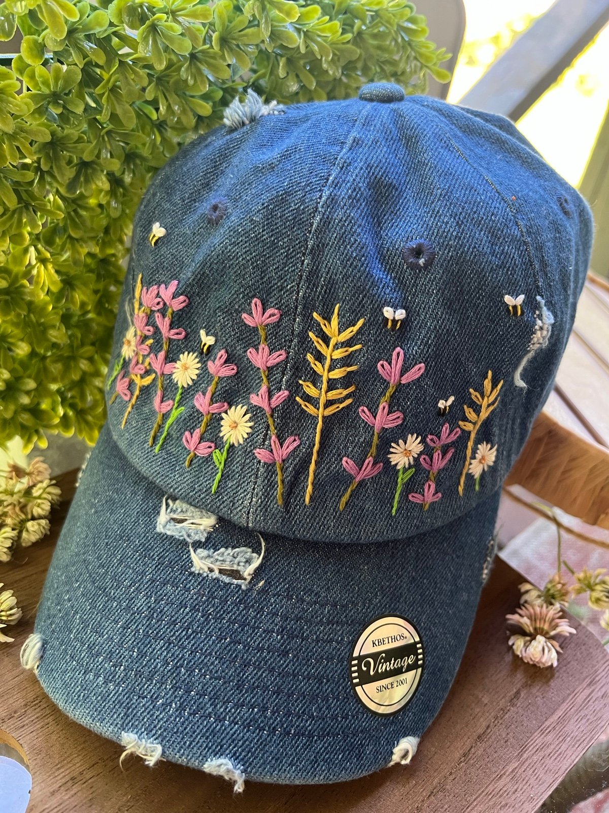 Hand-embroidered wildflower and bee hat