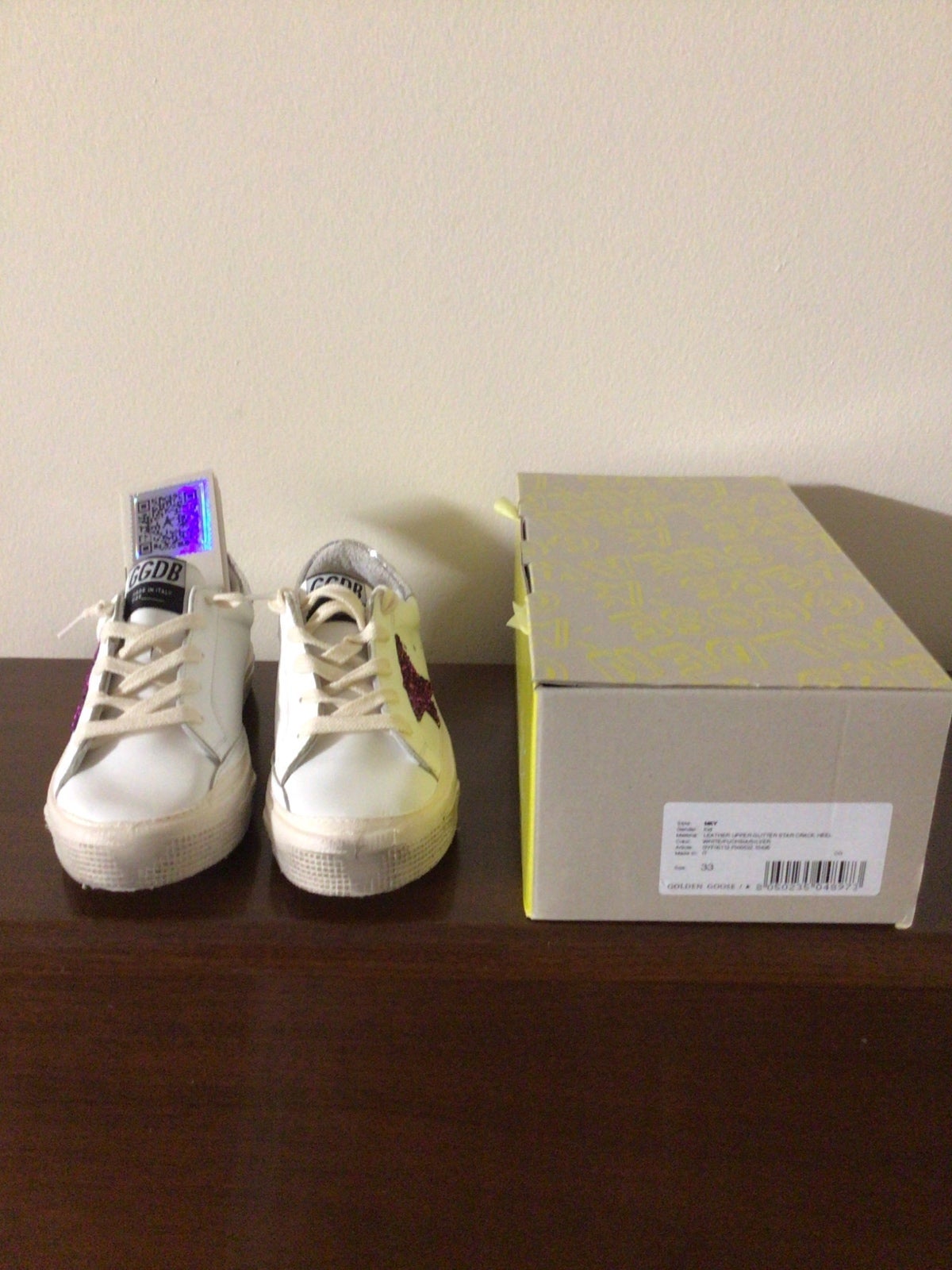 Golden goose kid sneakers.
