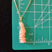 Carved angelskin coral geisha lady pendant gold tone chain necklace
