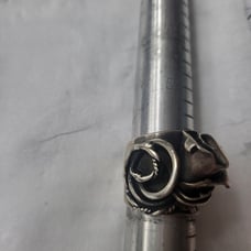 Unique sterling ring with rose pattern and small turquoise. Size 7