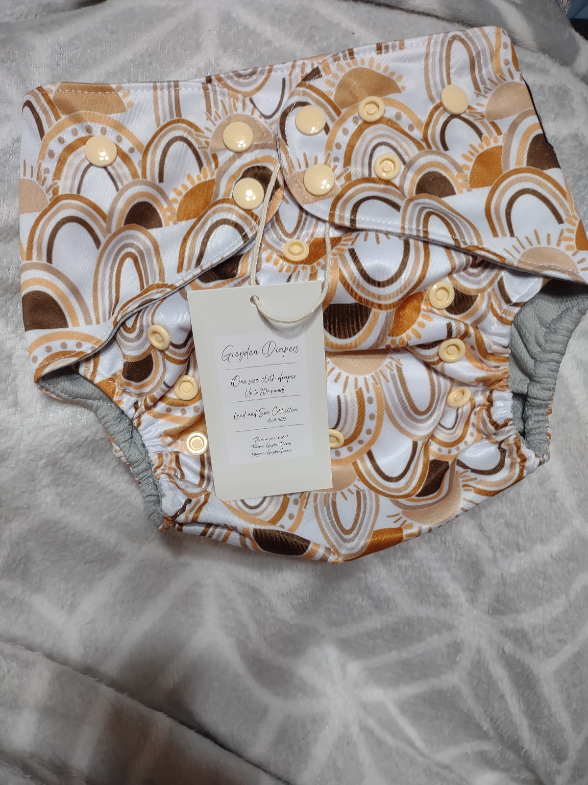 Greyden diaper golden rainbows