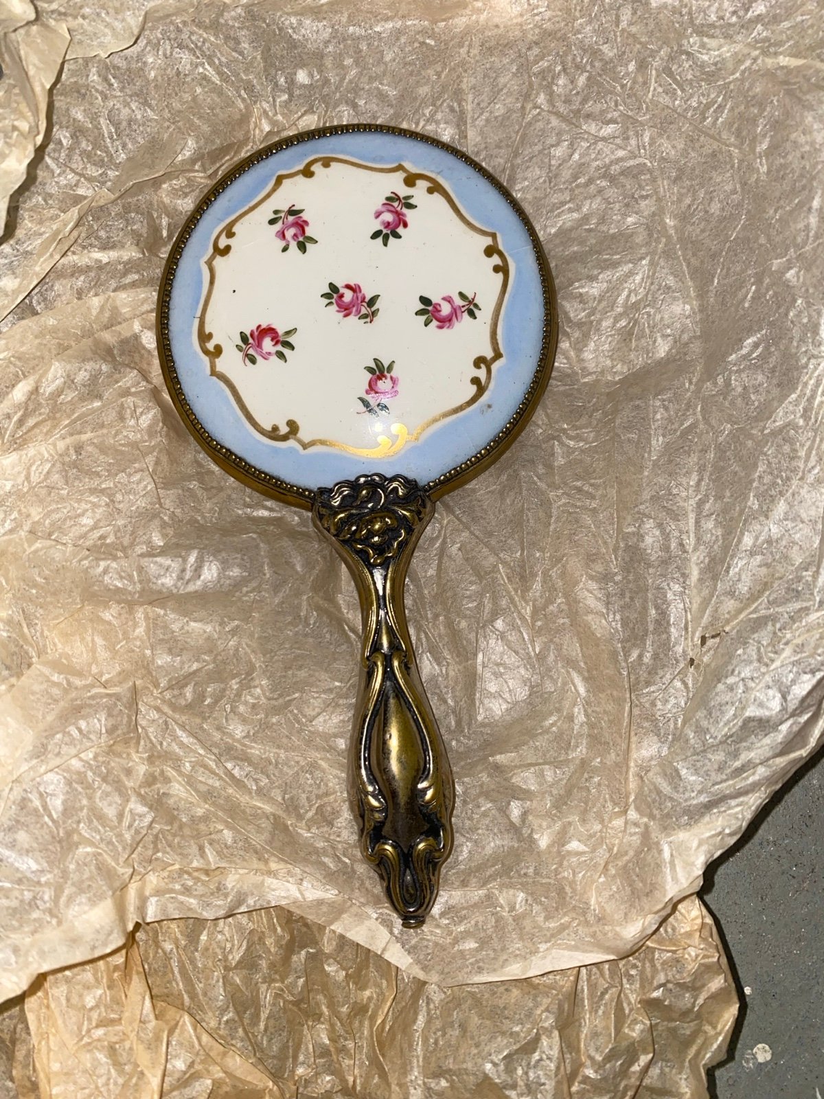 Antique vintage Victorian vanity hand mirror with baby blue paint, gold trim, an