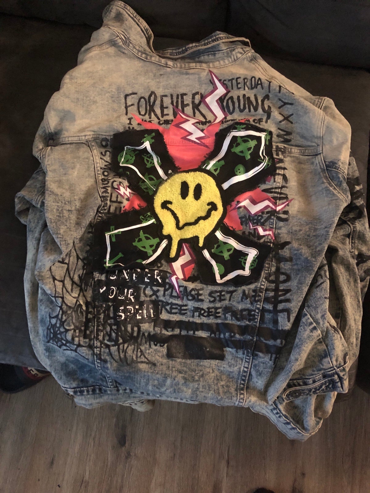 I’m selling a customized jacket With designs and smiley faces on it that I bough