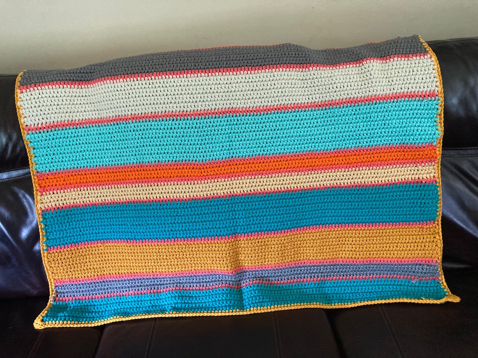Multi colored crocheted blanket