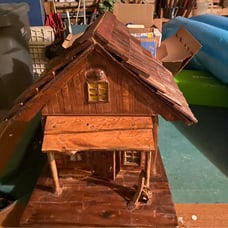 Im sellind a handcrafted house made out of assortments of wood and drift wood ,