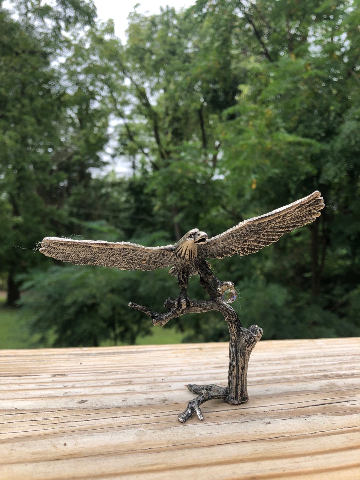 Vintage Silvertone eagle in flight holding a small crystal ball
