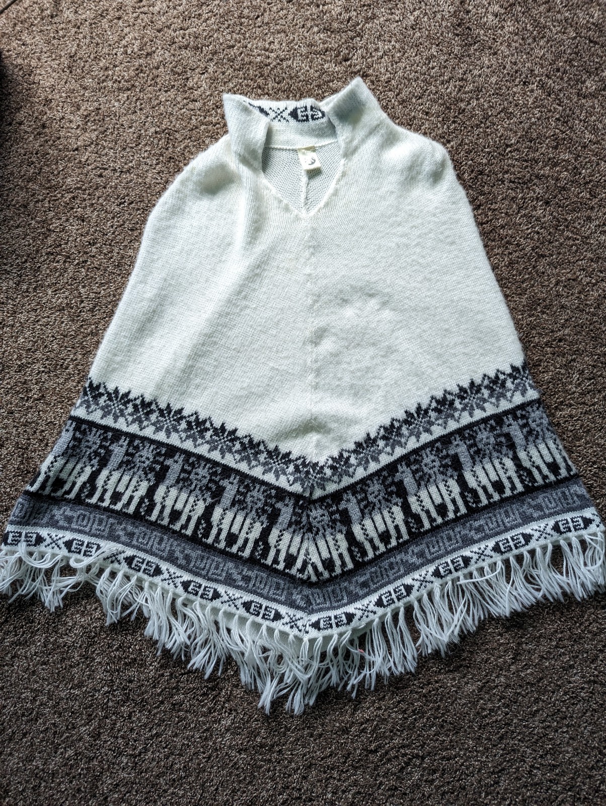 Handmade handcrafted knitted white poncho