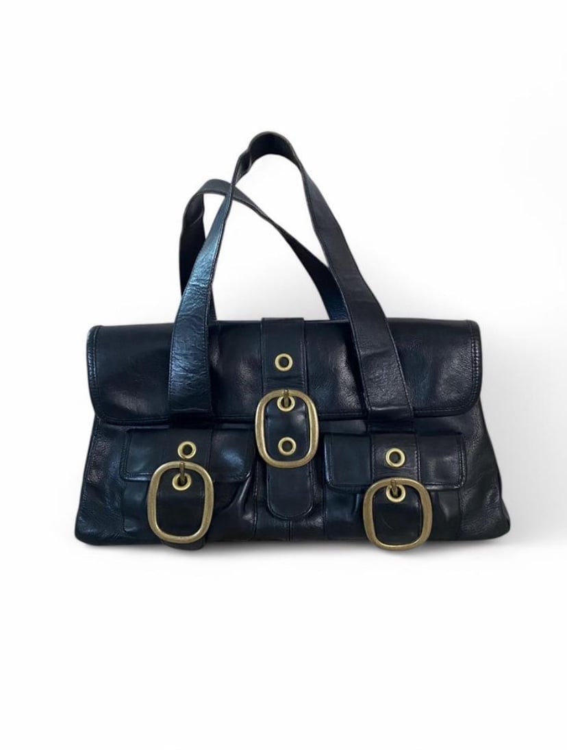 Black leather shoulder bag with chunky gold buckle hardware