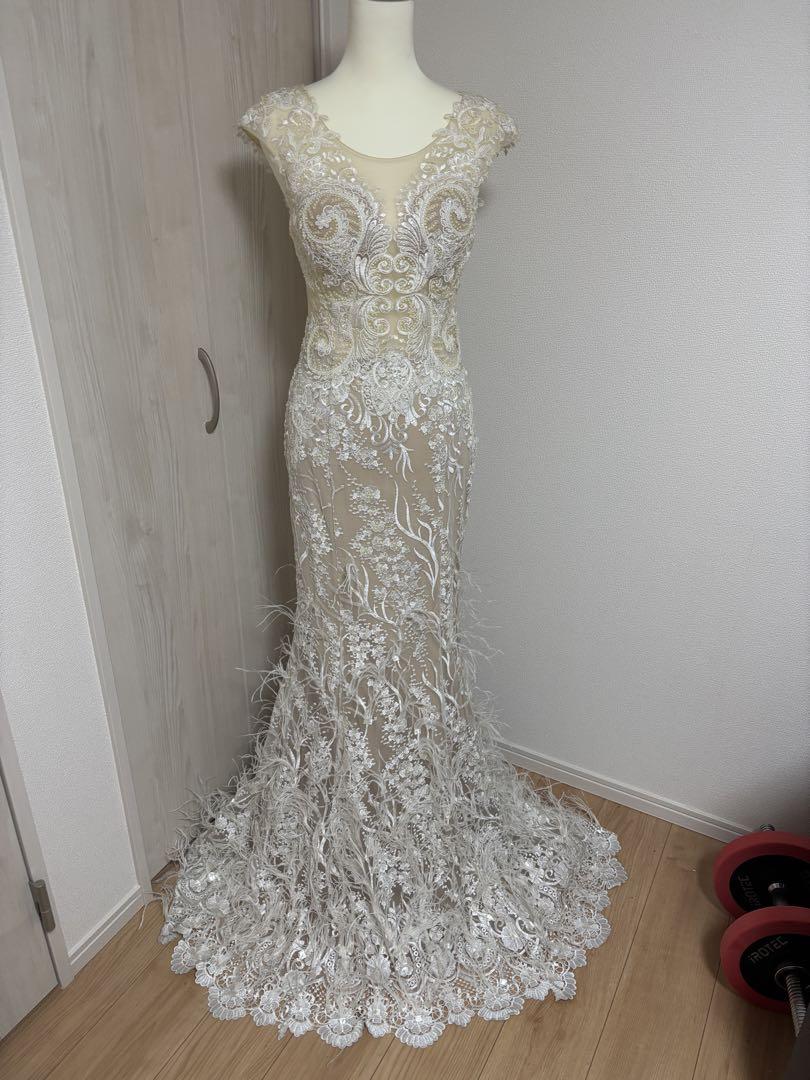 Cream-colored wedding dress with embroidery