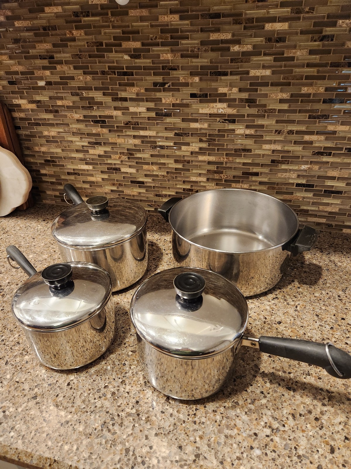 Set of Four Vintage Revere Ware Stainless Pots and Three Lids