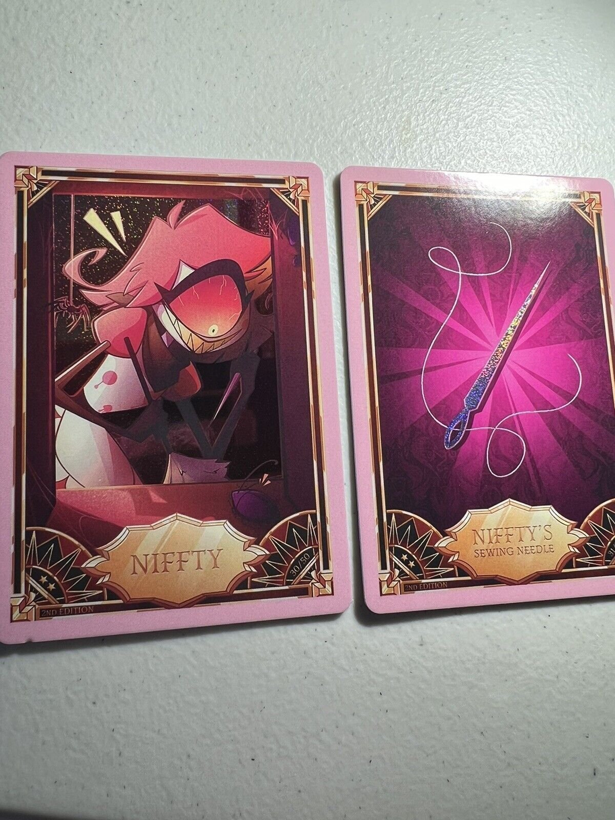 2 Cards: NIFFTY + Sewing Needle Hazbin Hotel 2nd Edition Trading Pink Holo Foil