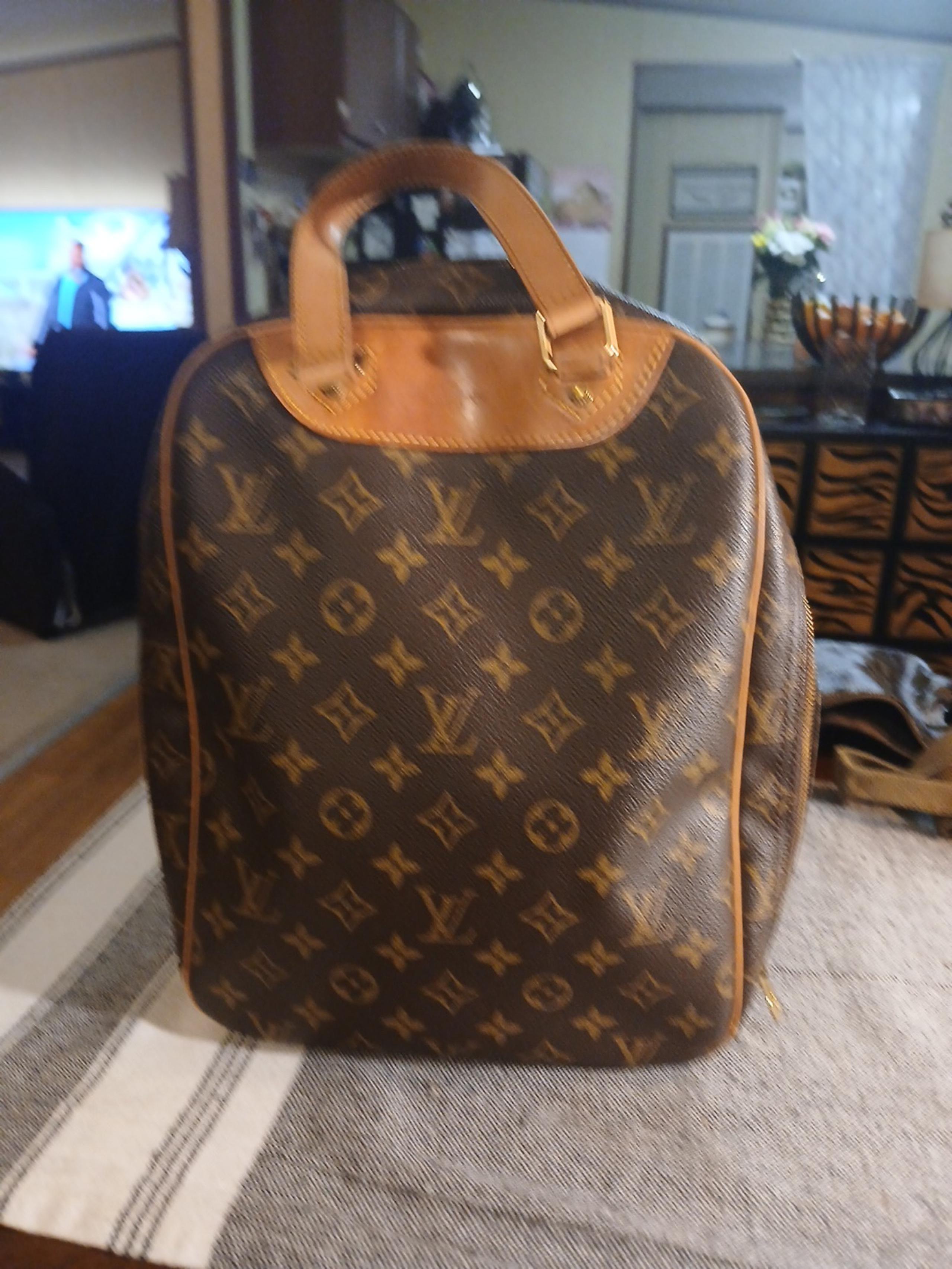 Authentic Louis Vuitton Monogram Excursion handbag M41450