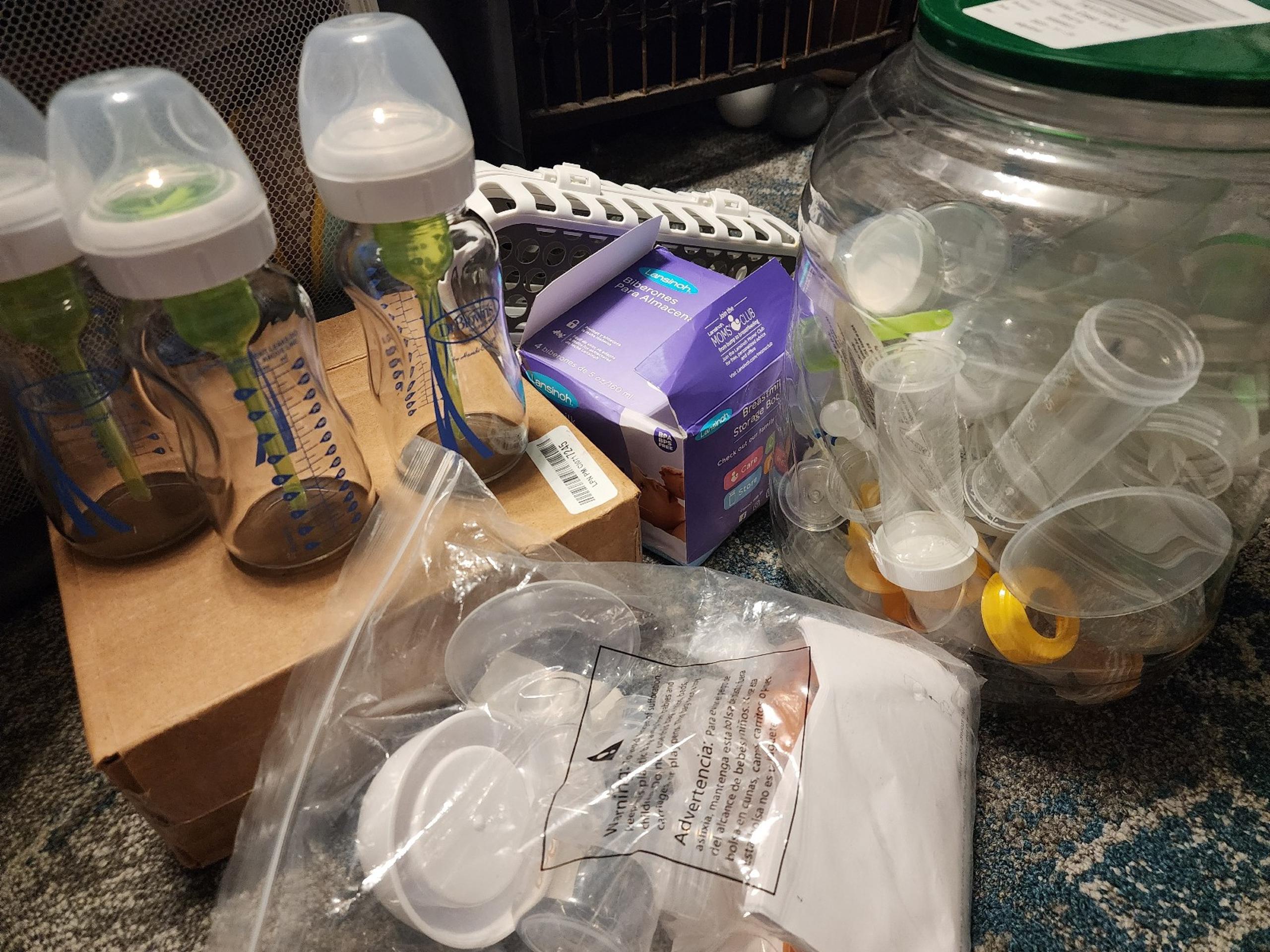 Baby bottles, Dr. Brown's, manual breast pump. Breast milk storage.