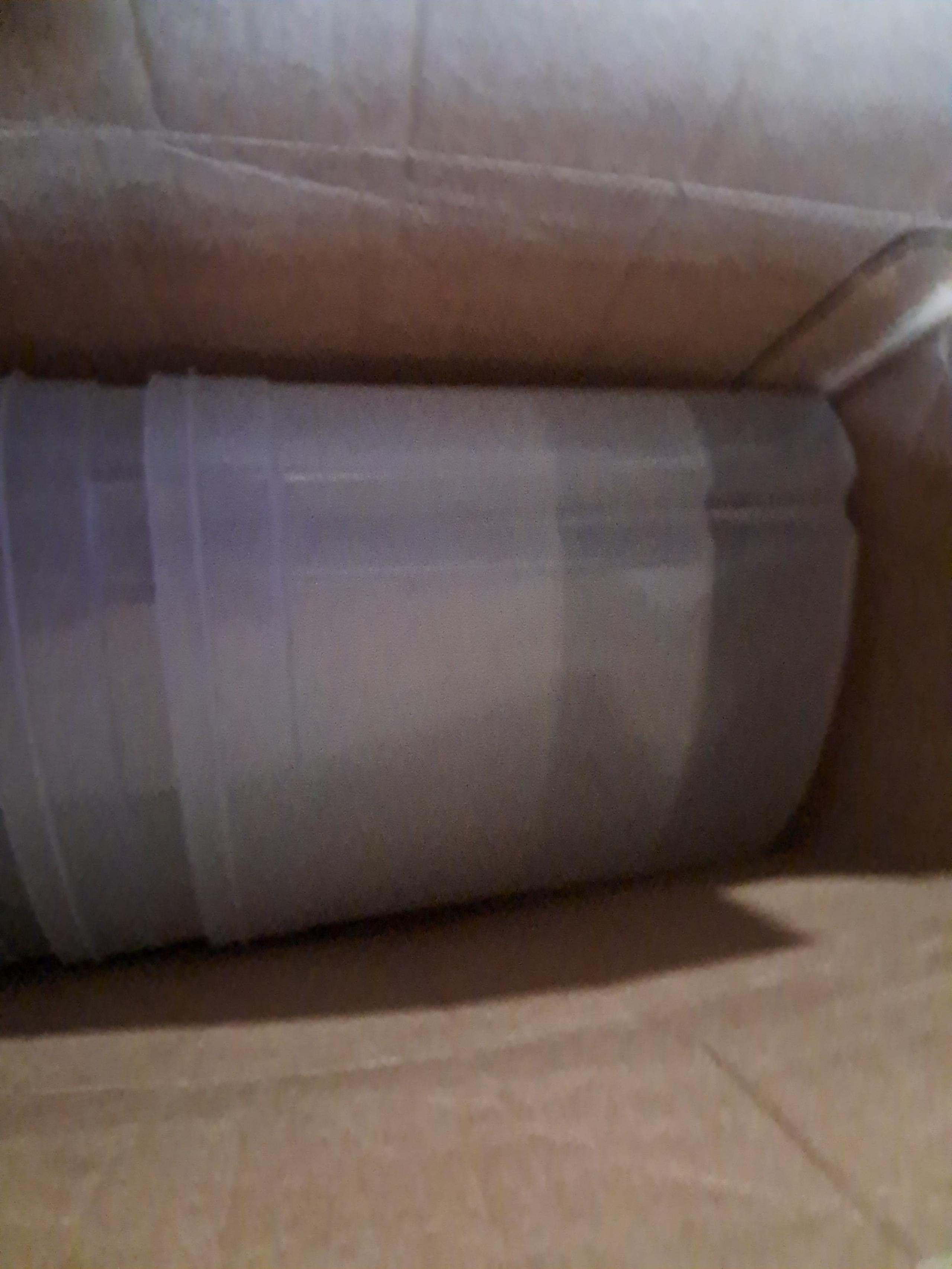2 Rubbermaid food storage containers with red lids.