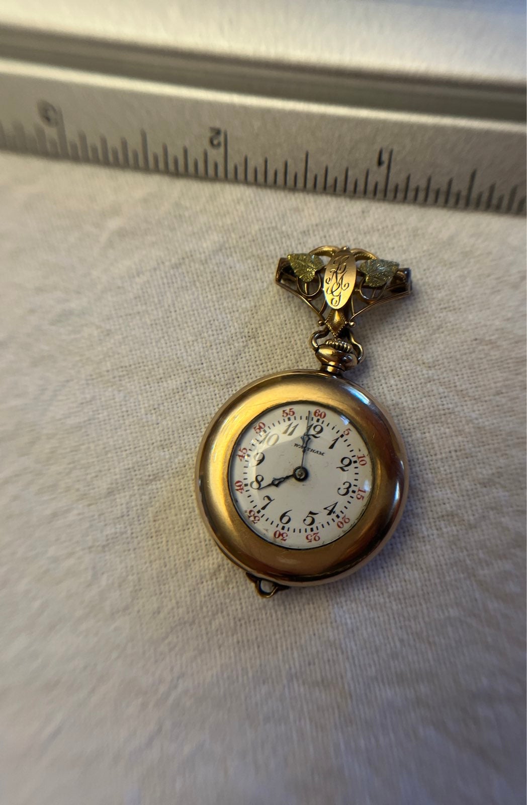 Vintage Waltham Women's Pocket watch with a trigold pin