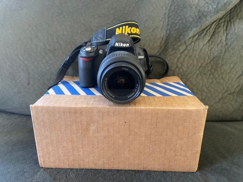 Nikon D3100 w/ Nikon DX AF-S Nikkor 18-55mm Lens and Camera Bag