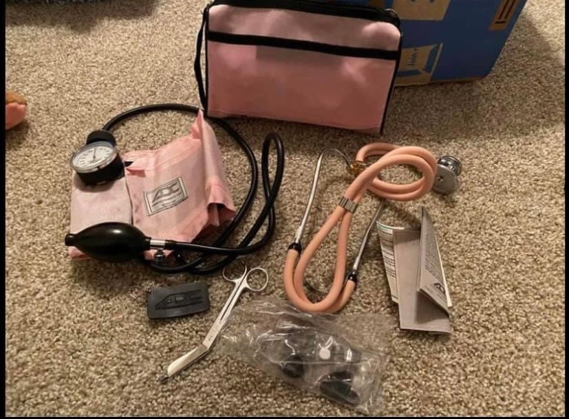 Stethoscope, blood pressure cuff, scissors, and case