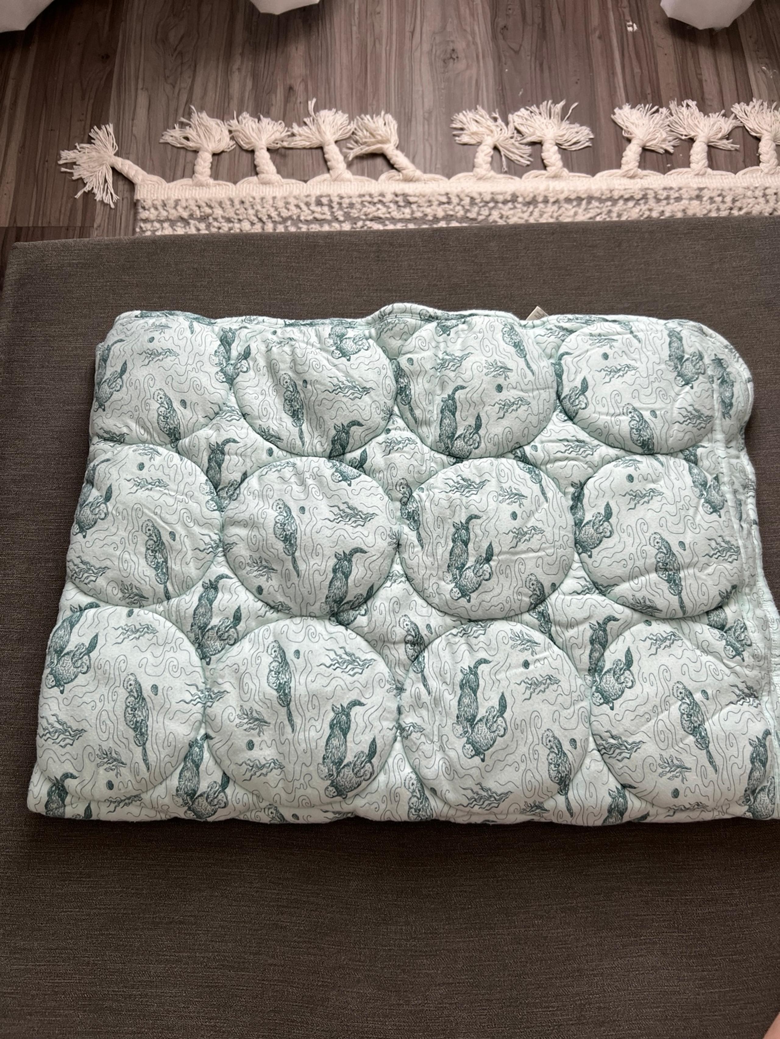 KATE QUINN BLUE OTTER QUILT