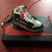 A collection of 7 Jordan key chain sneakers. Lowest cost on Internet. SAVE