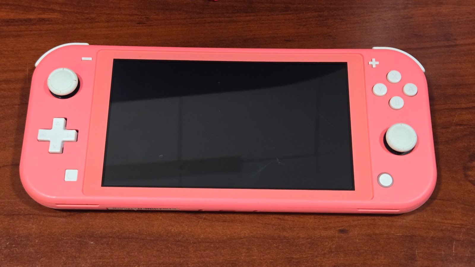 Nintendo Switch Lite Coral (minor wear)